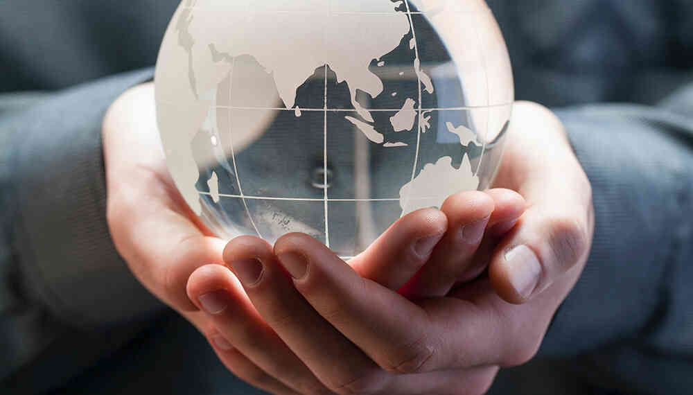 Hands holding the world. Credit: Photo by Geronimo Giqueaux on Unsplash, licensed under <a href=https://creativecommons.org/publicdomain/zero/1.0/>CC0</a>